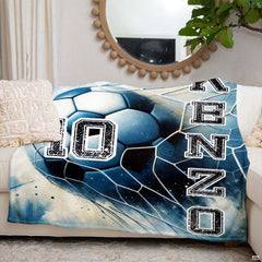 Soccer ball and goal net motif styled in an athletic bedroom with cool blue accents.