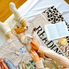 Cartoon girl reading with glasses on book stacks with leopard newsprint pattern, view 6.