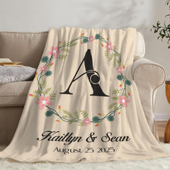 Wedding anniversary throw blanket draped decoratively across a neutral bedroom setting for elegant styling