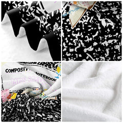 Close-up of decorative marble bedding set featuring detailed blooming floral graphics and books.