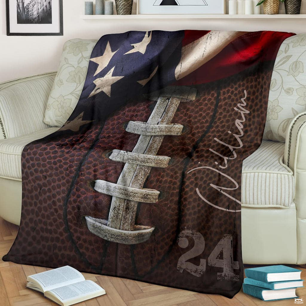 Vintage patriotic gridiron laced football blanket draped over sofa