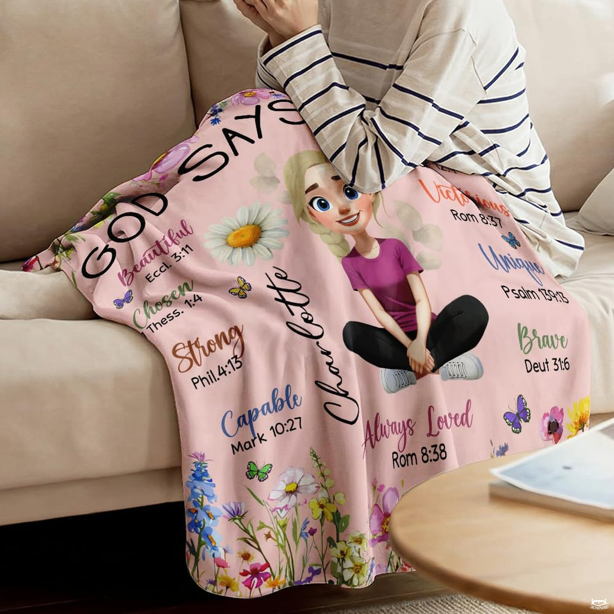 Floral scripture affirmation throw blanket styled across someone lounging on a couch