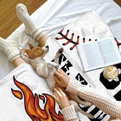Coordinated sports room decor highlighting energetic baseball graphics and fiery tones.