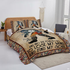 Overhead view of rustic Bigfoot quote bedding arranged neatly across a woodland cabin mattress