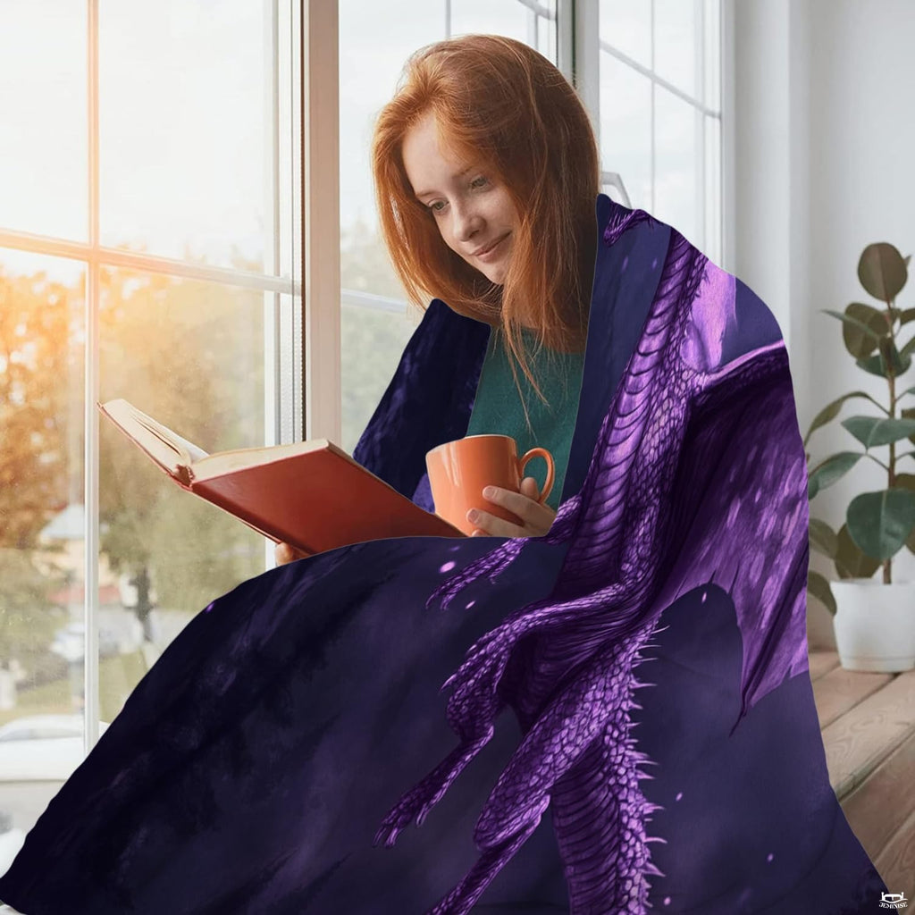 Nocturnal purple dragon throw blanket styled in a cozy lifestyle bed setting