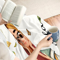 Carnation reader girl throw blanket draped gracefully over a living room sofa creating a cheerful room accent.
