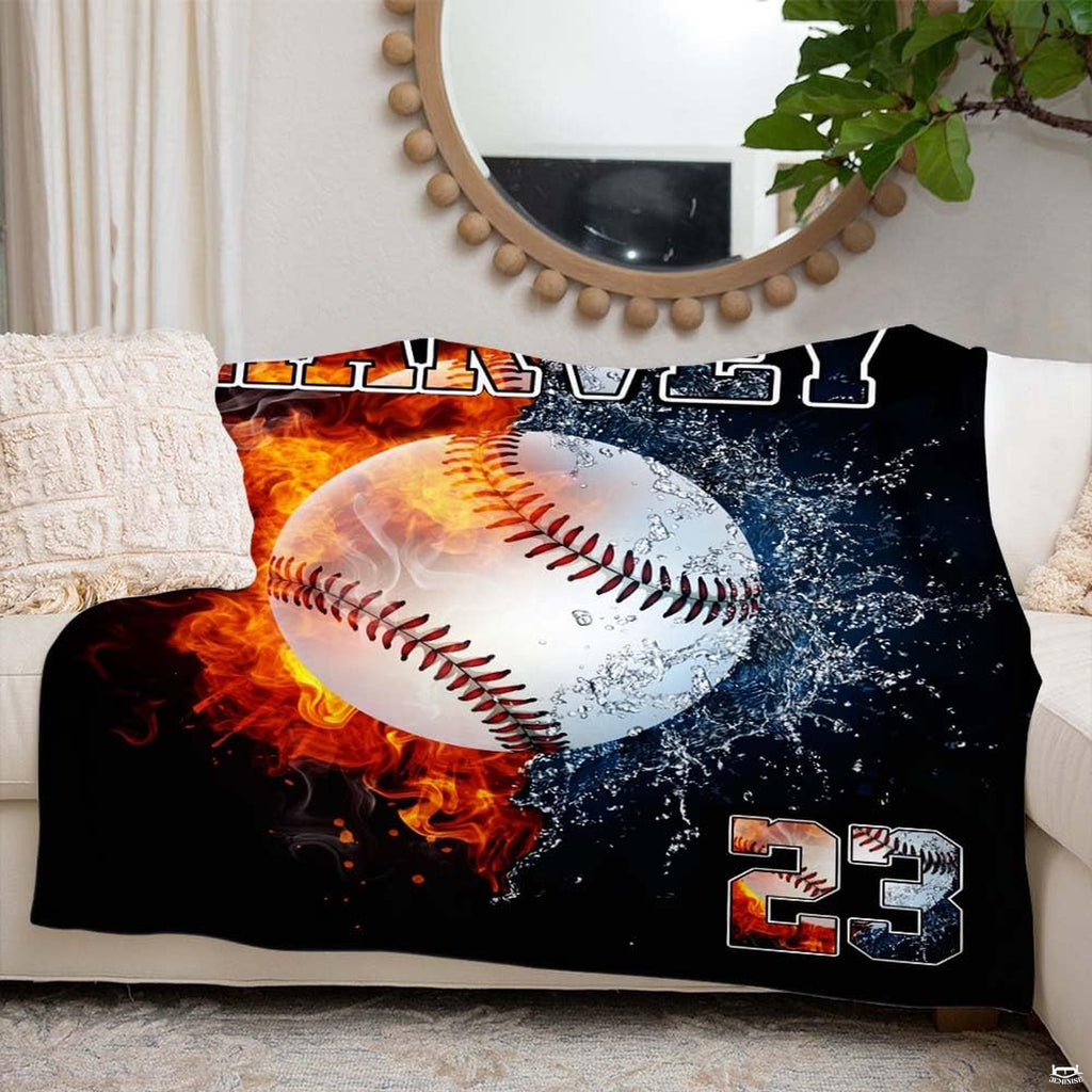 Full perspective of the fire and water baseball blanket held open in a bright living space.