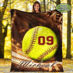 Softball glove graphic blanket draped over living room armchair