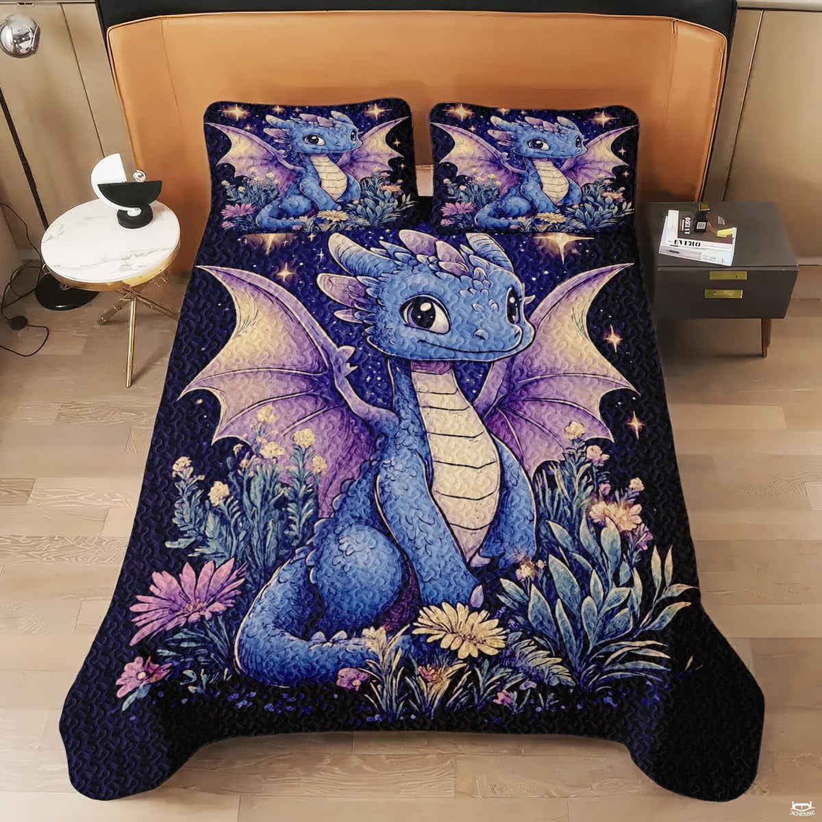 Overhead perspective of baby dragon bedding arranged neatly across a themed bedroom mattress