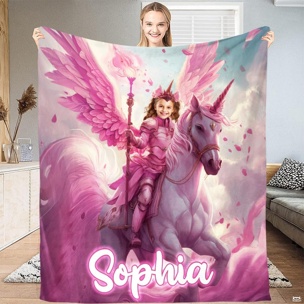 Woman standing and holding up full length pink winged unicorn blanket
