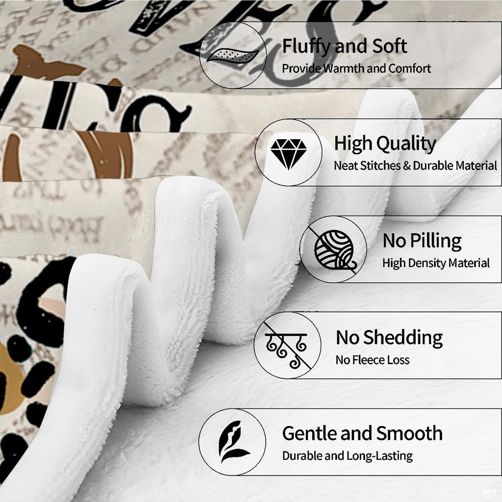 Living room staging displaying leopard print reader girl throw blanket styled on a grey sofa.