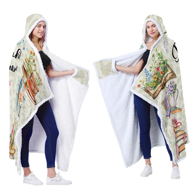Full display of chibi reader girl floral book stack blanket presented on model.