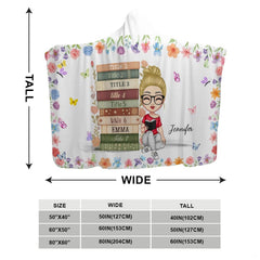 Overhead view of charm bedding set with pastel blossoms and reading artwork.