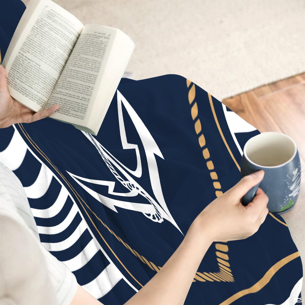 thematic accent view of navy blue coastal bedding set accentuating maritime sailor stripes in a bright room.