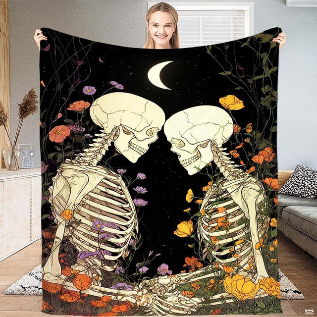 Intertwined skeleton lovers surrounded by wildflowers under crescent moon, view 1.