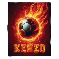 Flaming soccer ball graphic textile laid flat in studio overview