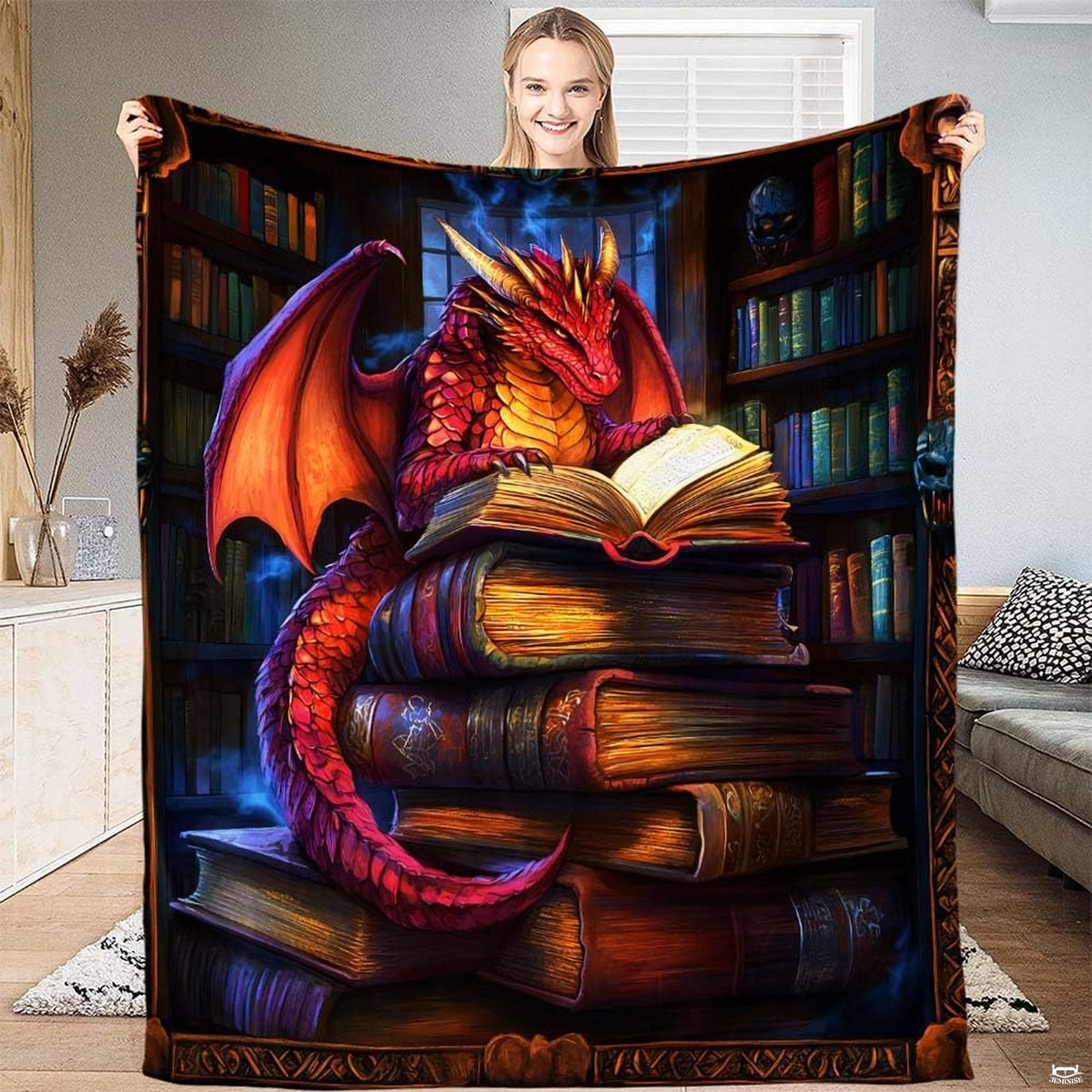 Red dragon reading blanket featuring a crimson winged dragon studying an open book on book stack.