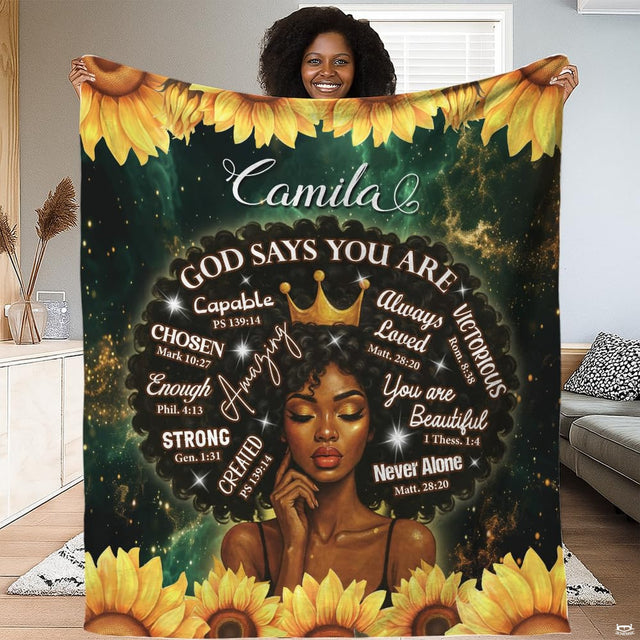 God says you are sunflower crown scripture throw blanket held open by woman