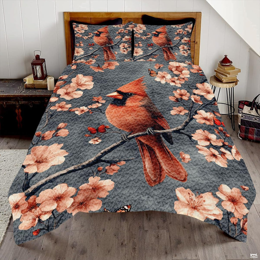 Slate grey winter cardinal songbird botanical bedding set displayed neatly on a bed in a modern bedroom