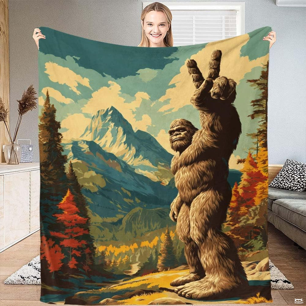 Bigfoot peace sign mountain forest blanket held upright by smiling woman