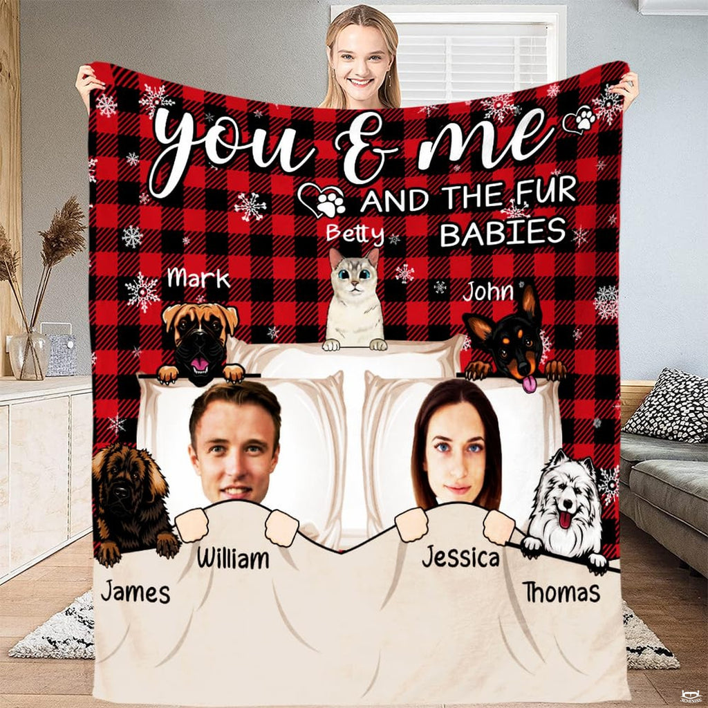 Illustrated couple and cartoon pets on red and black buffalo plaid background, view 1.