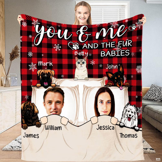 Illustrated couple and cartoon pets on red and black buffalo plaid background, view 1.