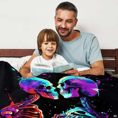 Close-up perspective of graffiti splatter skeleton figures on throw blanket