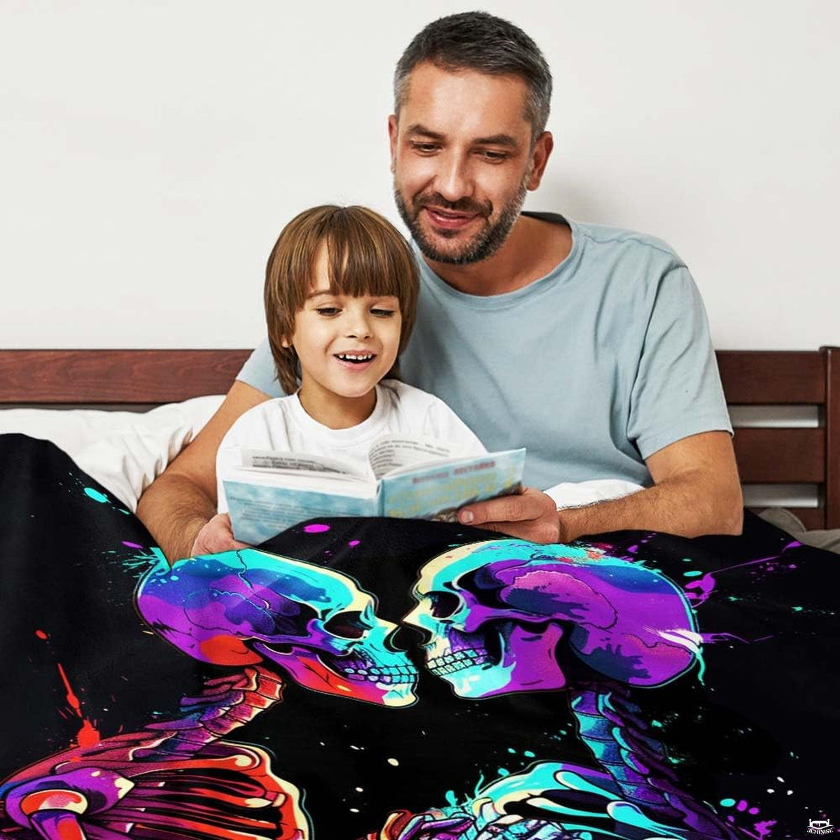 Close-up perspective of graffiti splatter skeleton figures on throw blanket