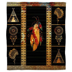 Bedding set displaying detailed Aztec geometric borders with rust red, turquoise, and gold artwork on black.