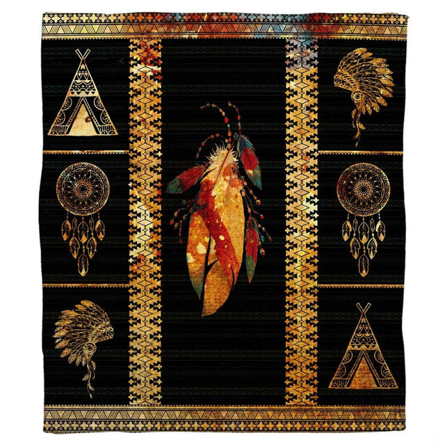 Bedding set displaying detailed Aztec geometric borders with rust red, turquoise, and gold artwork on black.