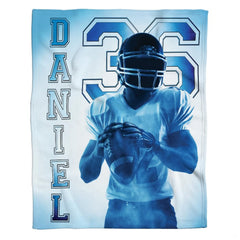 Top view of sports bedding set showcasing bold football player illustration and numbers.