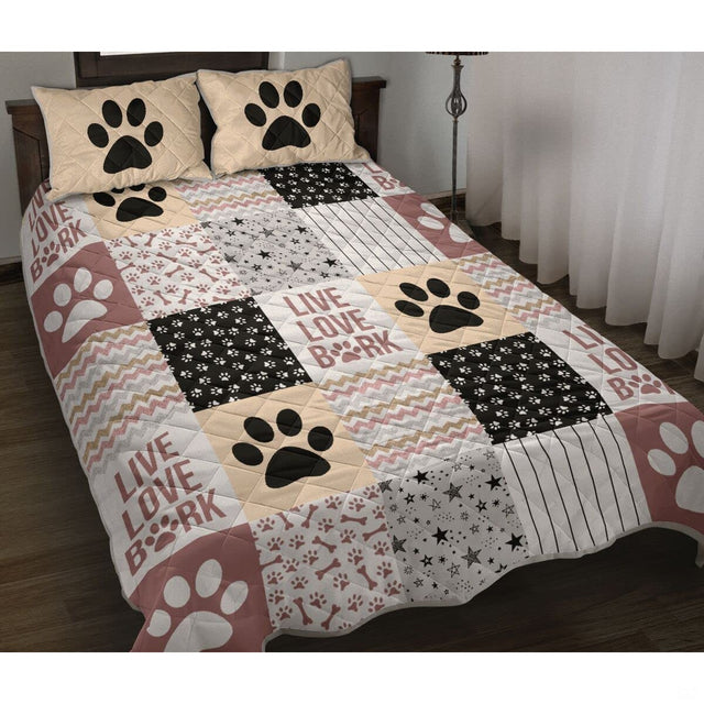 Dog themed bedding for girls displaying puppy paw prints and rustic mauve patchwork decor.