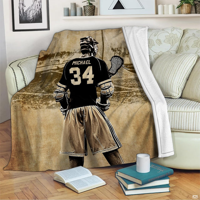 Lacrosse player graphic blanket draped over living room sofa with books