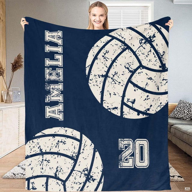 Close view of collegiate block typography and athletic artwork on dark navy blue bedding.
