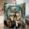 Wolf pair resting inside a beaded turquoise dreamcatcher hoop against a misty pine forest background.
