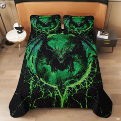 Overhead perspective of green lava dragon bedding arranged neatly across a themed bedroom mattress