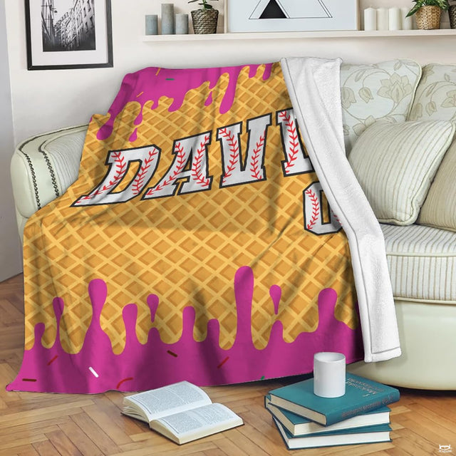 Detailed view of athletic varsity numbers with baseball seam art on sweet treat bedding.