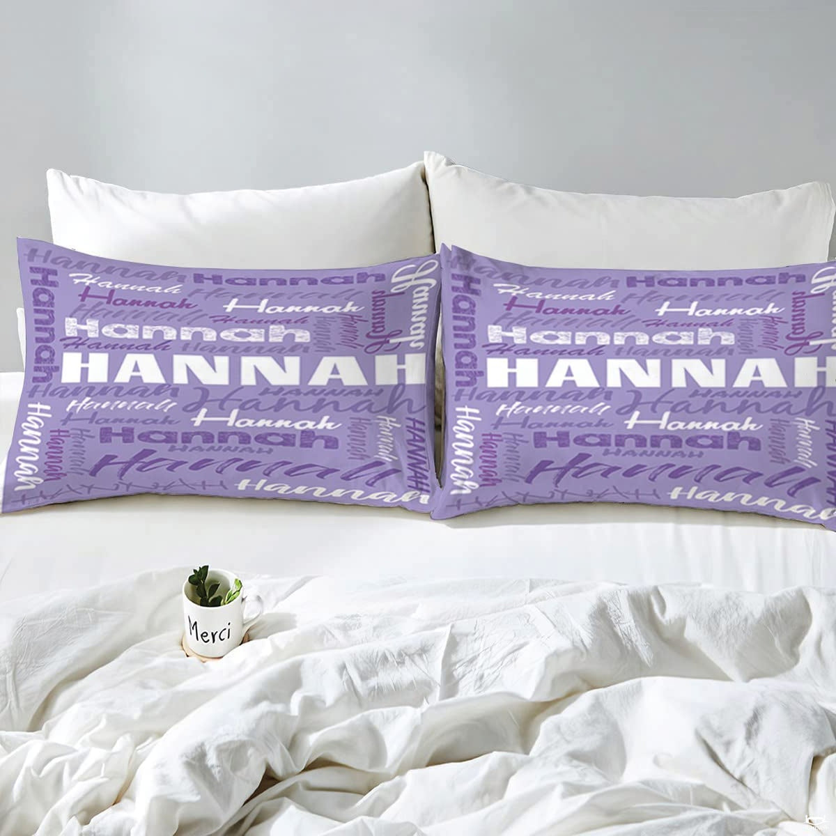 Close view highlighting artistic purple font variations and textured typographic prints on bedding.
