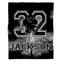 Action football player artwork in black and white for dynamic football bedroom decor ideas.