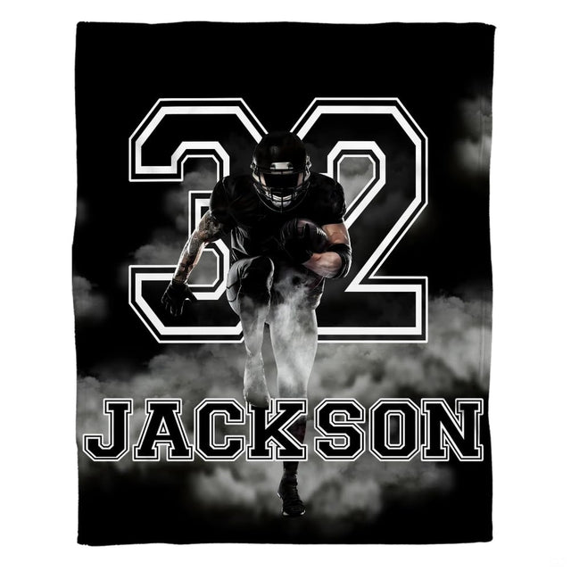 Action football player artwork in black and white for dynamic football bedroom decor ideas.