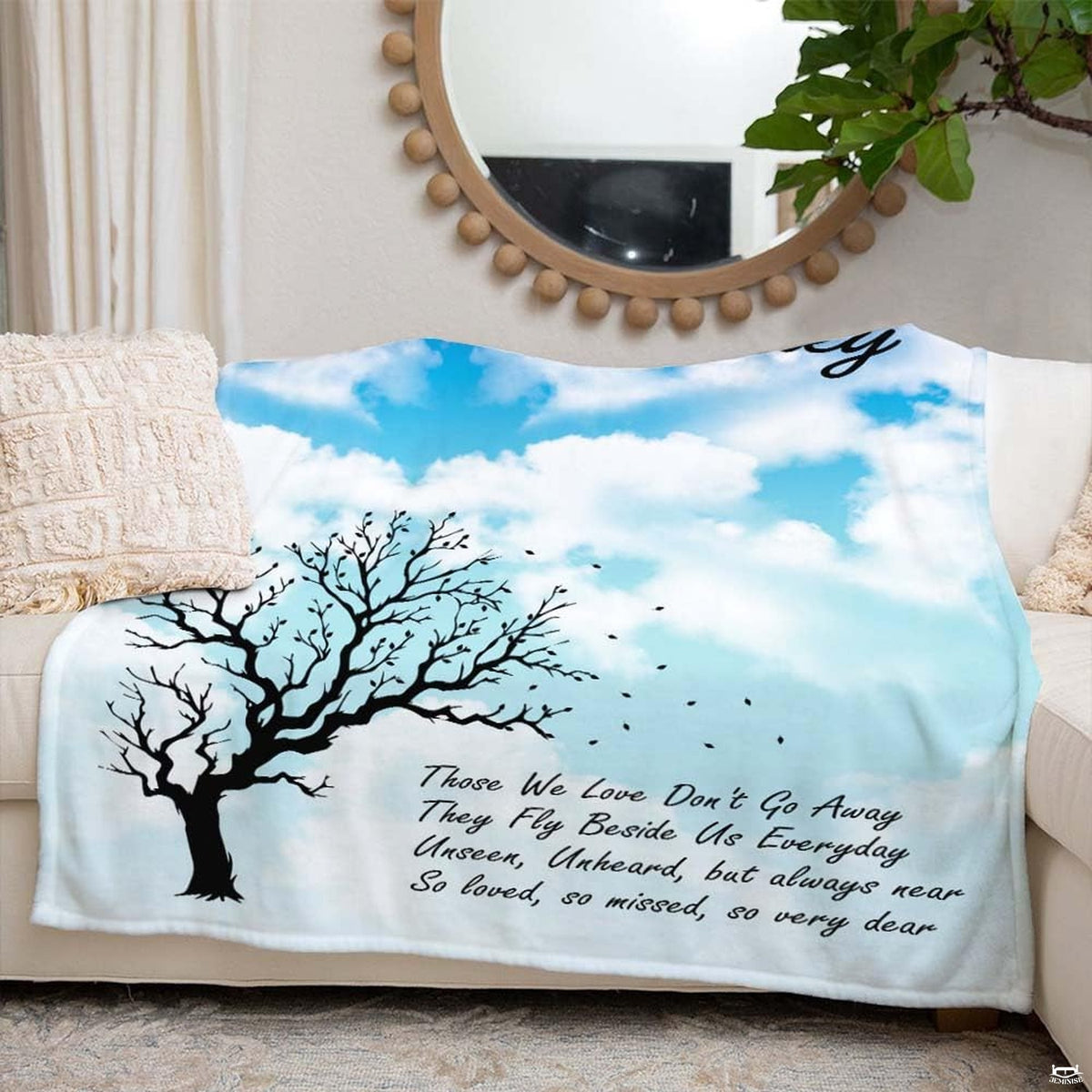 Artistic tree illustration and drifting leaf graphics creating an airy, peaceful ambiance for room styling.