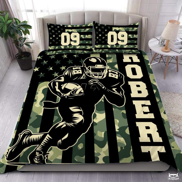 Camouflage flag football sports bedding set displayed on tufted bed in modern bedroom.