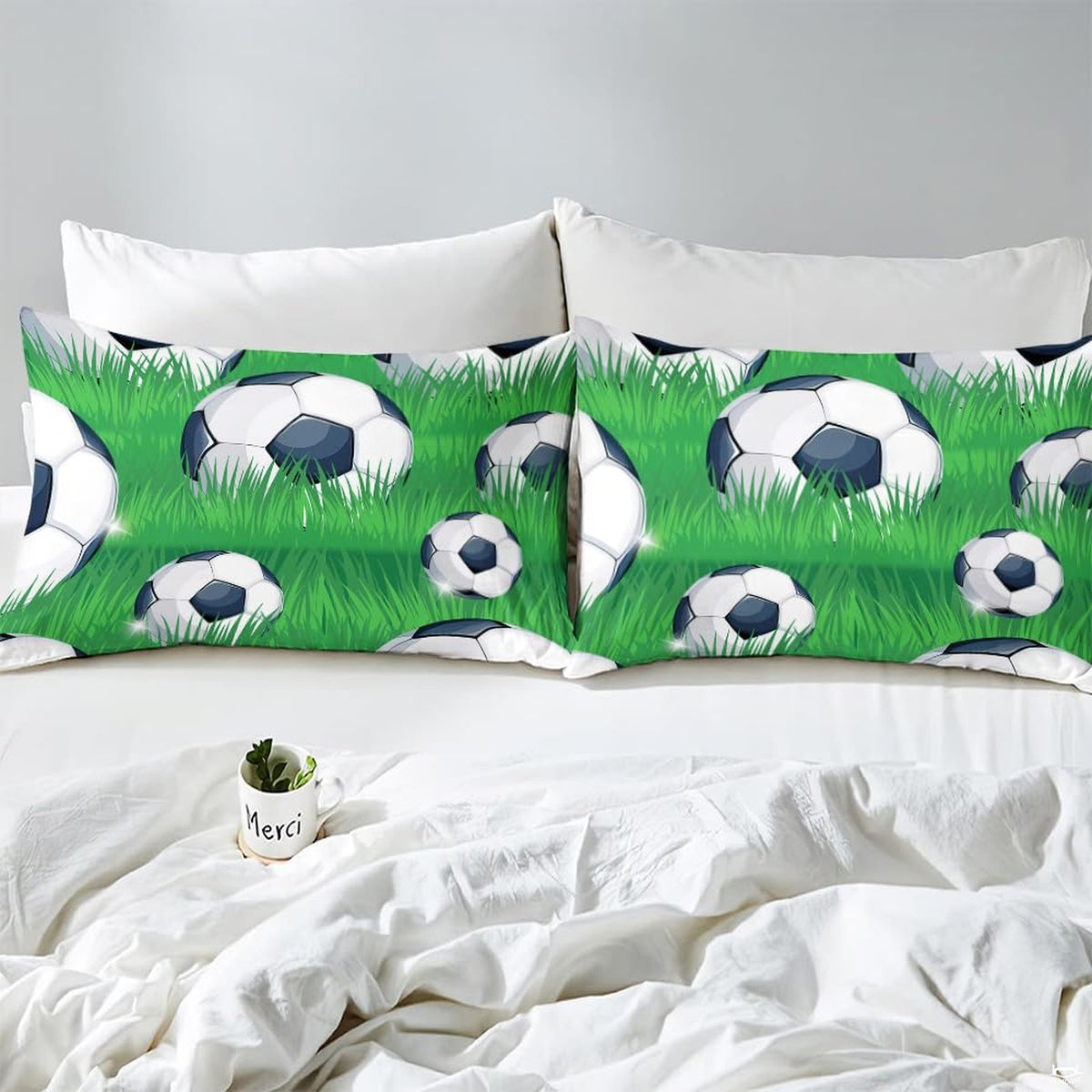 Styled bedroom scene displaying the emerald pitch sports graphic design across the bed setup.