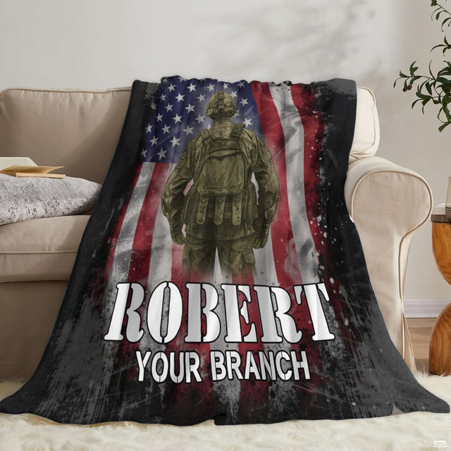 Tactical soldier patriotic flag blanket arranged across couch.