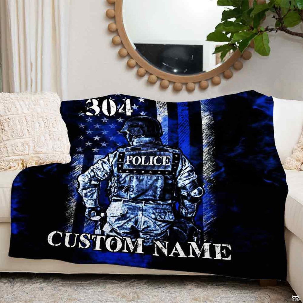 Patriotic law enforcement bedding display in modern bedroom with slate interior accents.