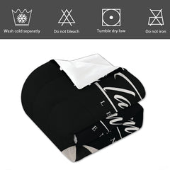 Angled perspective of black soccer bedding highlighting elegant athletic typography