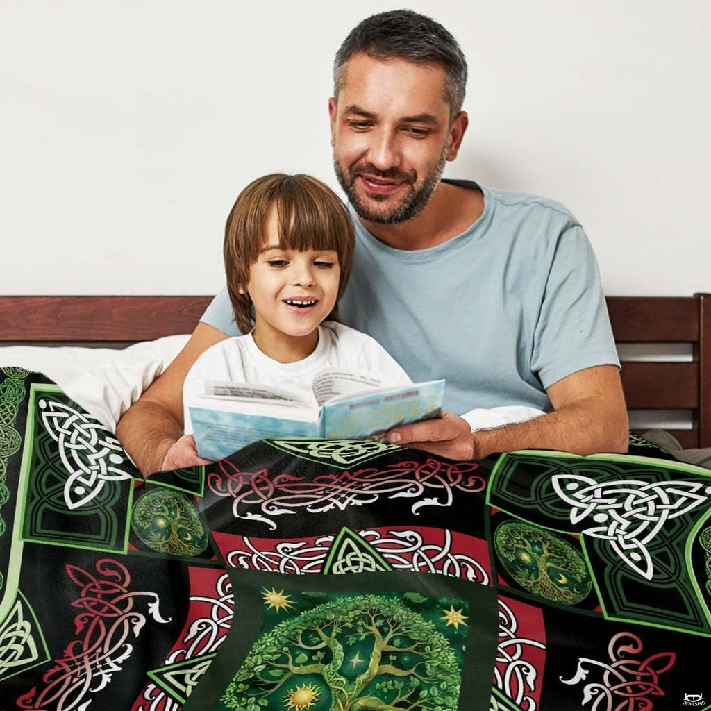 Overhead presentation of celestial sun, stars, and interlaced ribbon accents on forest green bedding.