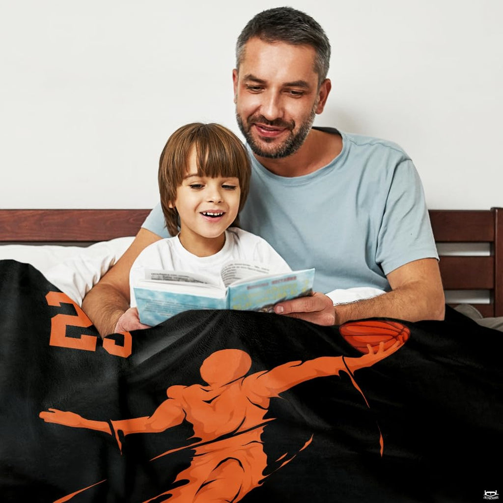 Close-up view of stylized speed streaks and slam dunk player silhouette graphics on black bedding.