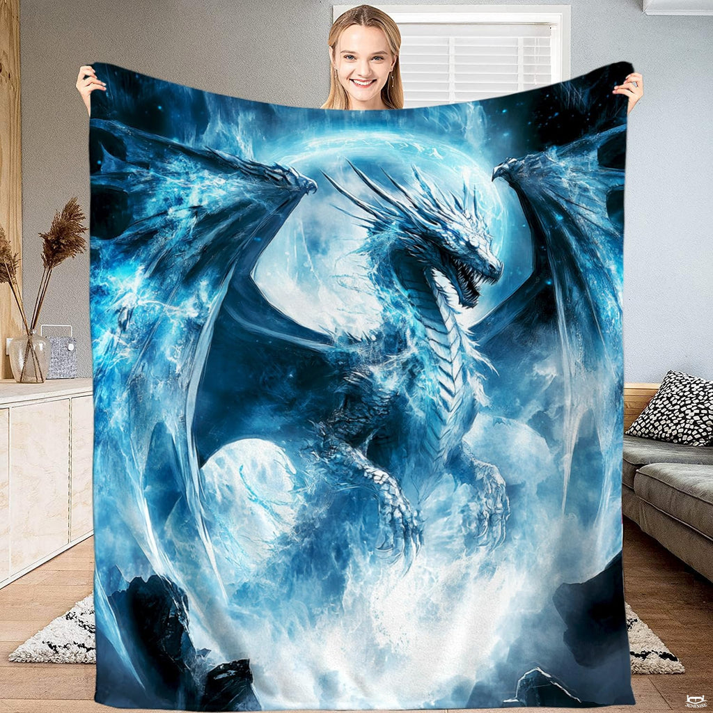 Glacial ice dragon throw blanket featuring a mighty winged dragon emerging from blizzard clouds before a glowing moon