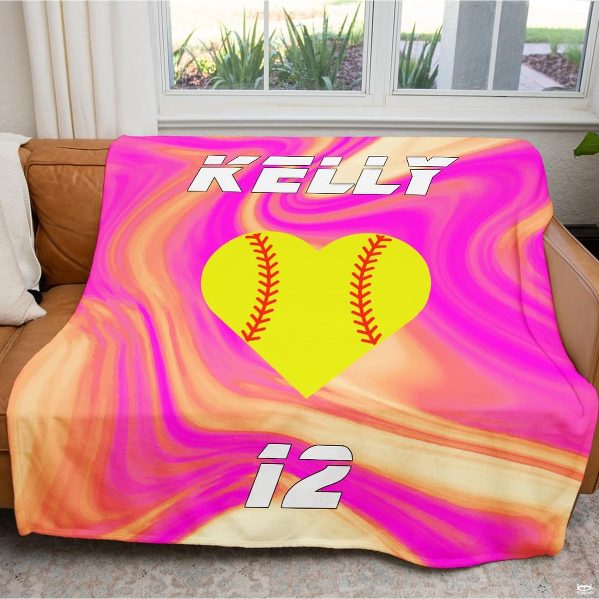 Close view of chartreuse heart graphic and red chevron lacing on blanket